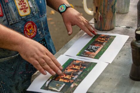 Image of finished mural sits printed on the on table