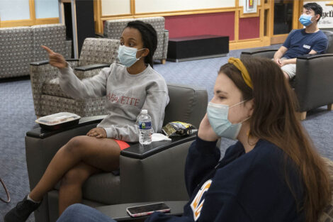 Students watch the first Presidential Debate for the 2020 election at the Farinon College Center.