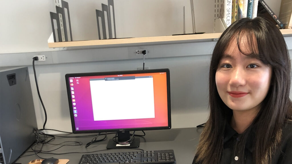 Zhaoyi Ding sits at her computer