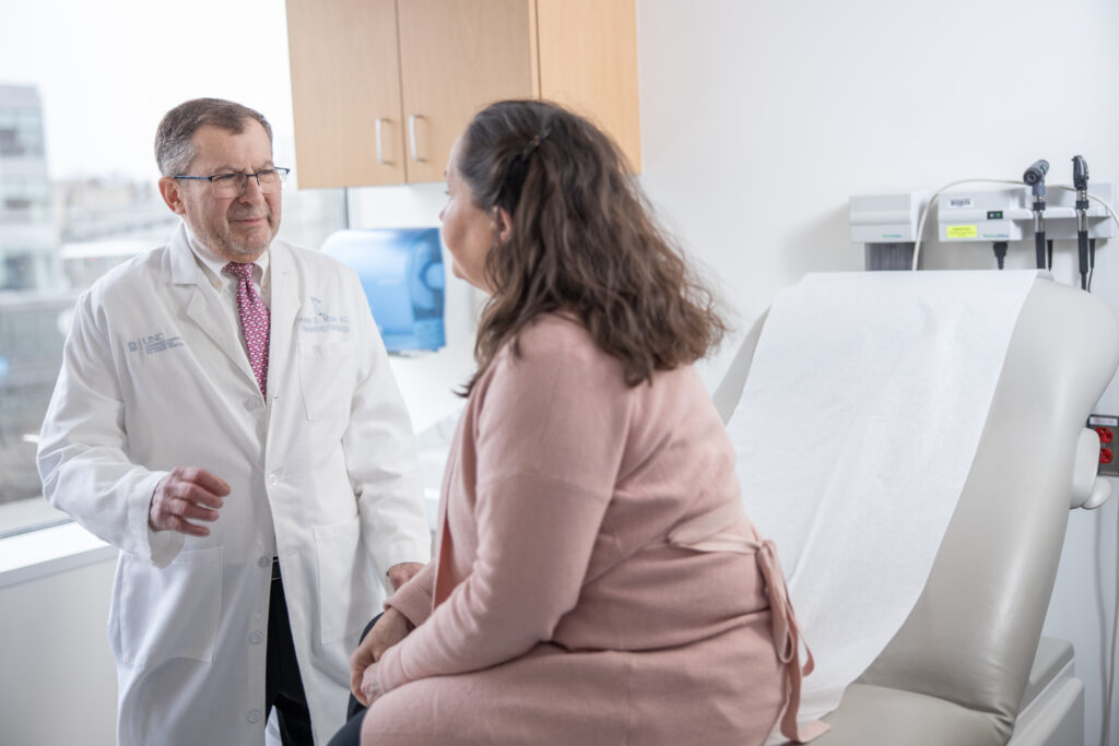 Dr. Hyman Muss with patient