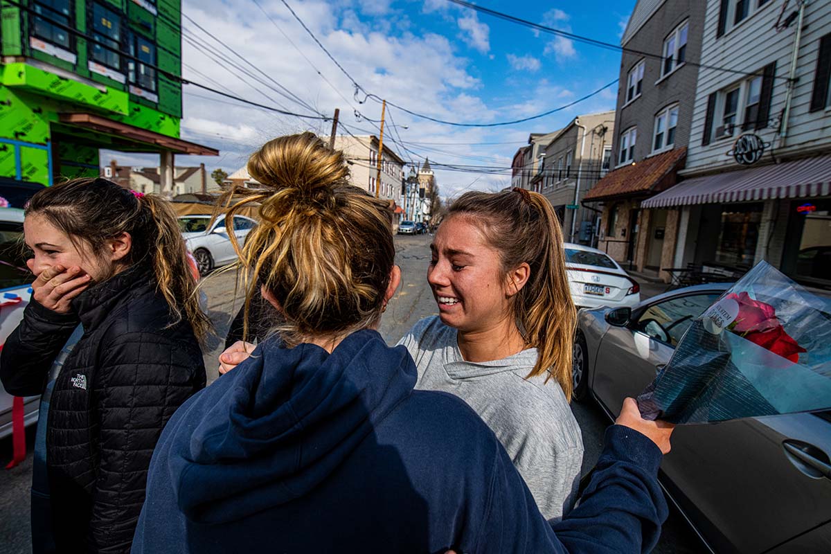 Students embrace on a street near Lafayette's campus