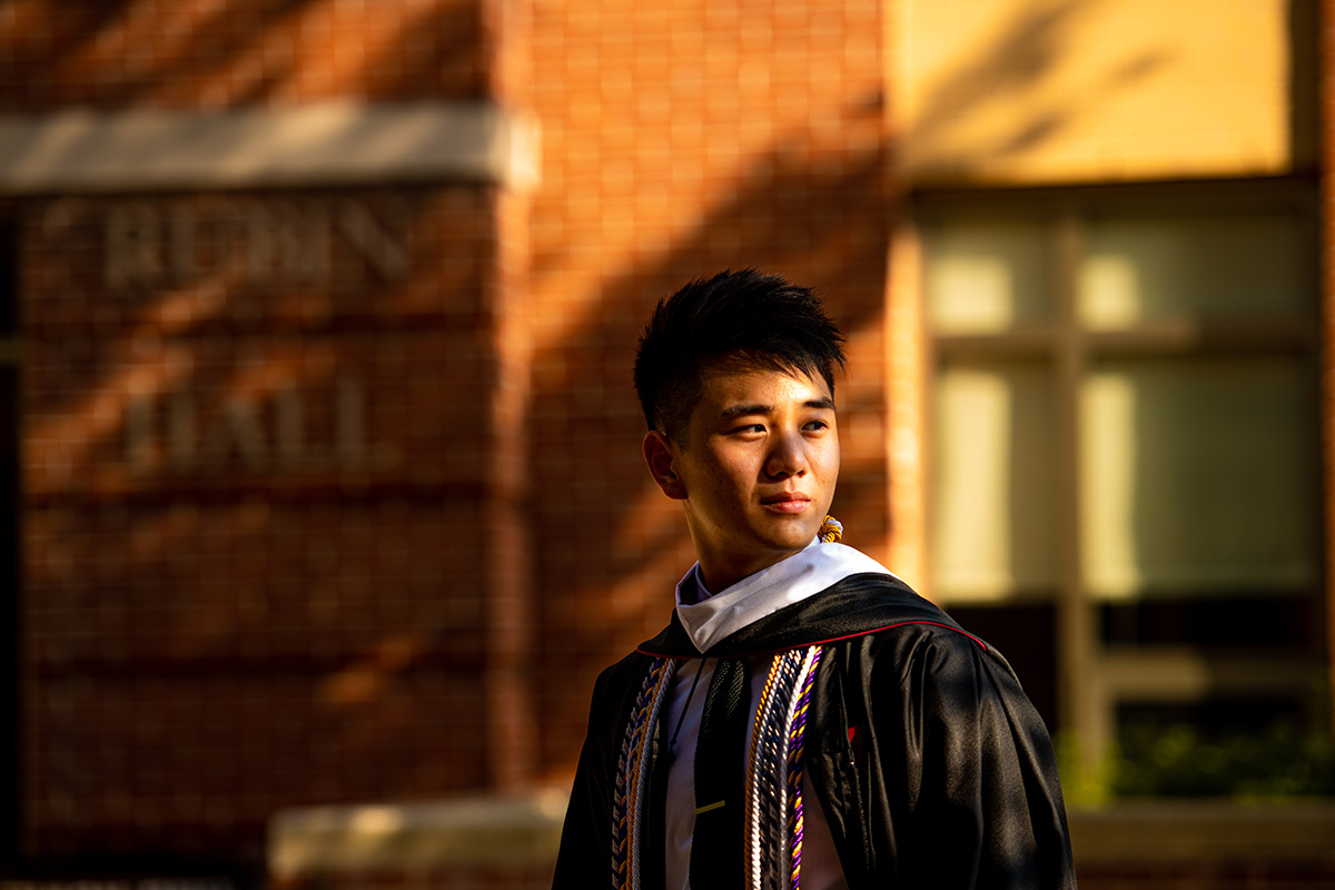 Randy Zhou '20 in graduation cap and gow n