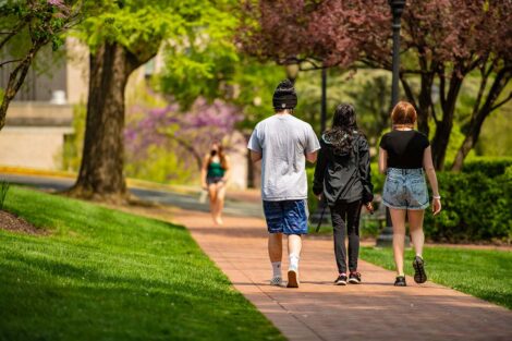 Students walk away on the Quad.