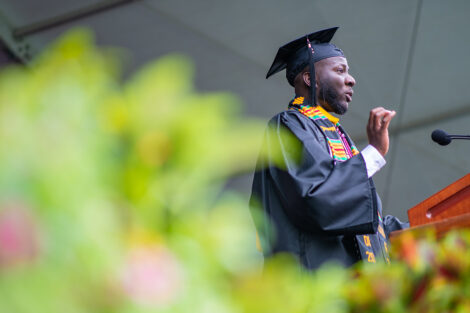 Basit delivering Commencement speech