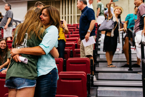 A student embraces their loved one.