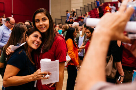 A student embraces their loved one.