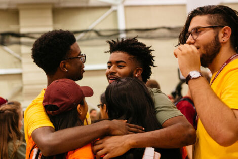 A student embraces thier loved ones.