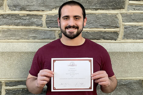 Devin Rosmarin holds certificate