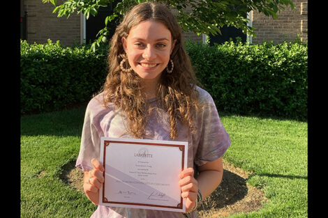 Genevieve Craig holds certificate