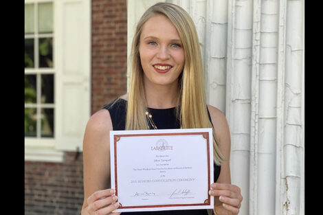 Jillian Updegraff holds certificate