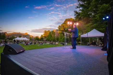Senior speaker Jerry Greenfield speaks to students on the Quad.