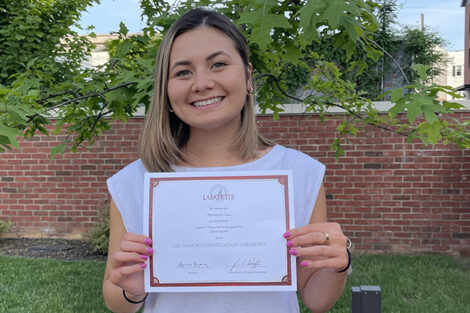 Theresa Chua holds certificate