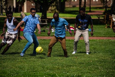 Students play soccer on the grassy Quad.