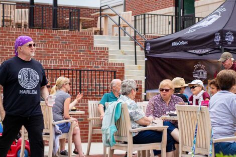 customers at Trolley Stop eat at tables outside