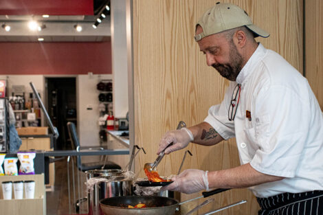 chef serves food at Trolley Stop open house