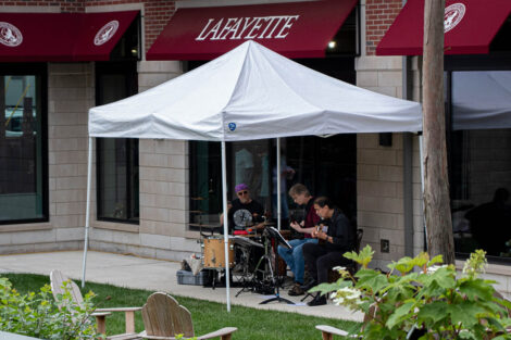 musicians play under a tent at Trolley Stop open house
