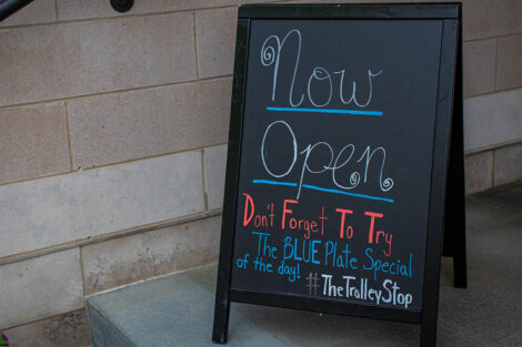 now open sign outside Trolley Stop