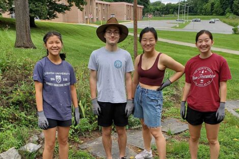 A team of workers smile at the start of the project