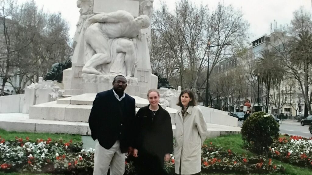 Emily Fogelberg Anthony ’05 (center) with Profs. Gladstone "Fluney" Hutchinson and Ute Schumacher presenting research at Atlantic Economic Conference in Lisbon, Portugal, in 2004.