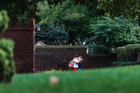 parent and student embrace in the distance