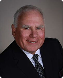 Photo of Brad Meigs Class of 1971 in a suit 