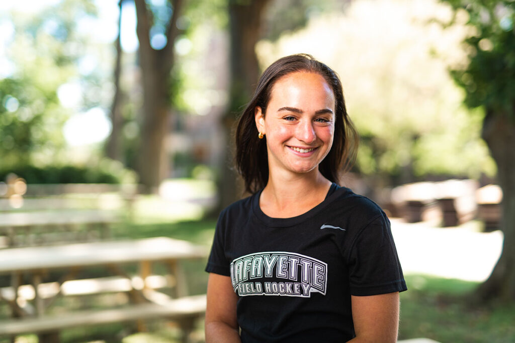 Alix Talkow in front of picnic tables.