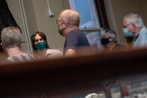 Families inside of Van Wickle Hall, masked.