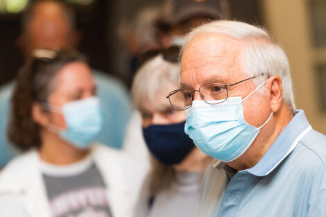 Families inside of Van Wickle Hall, masked.
