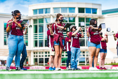 Band members play flutes.