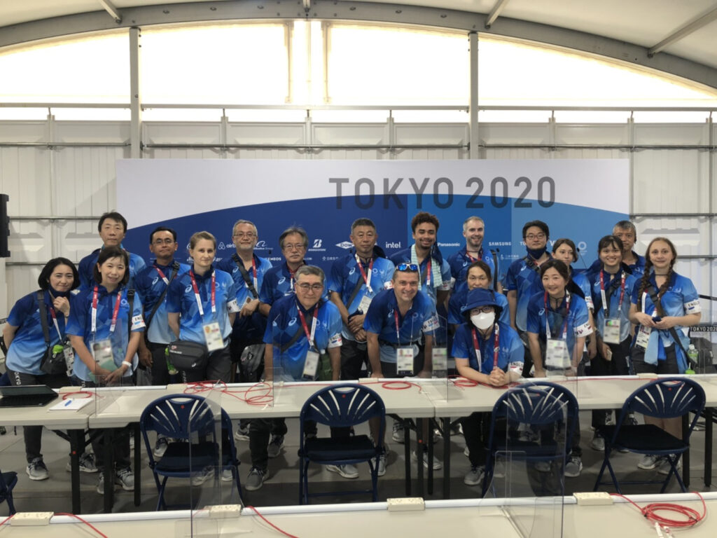 Chris Baylor '22 poses with a group of translators at the Tokyo Summer Olympics