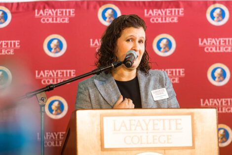 President Nicole Hurd speaks at a podium.
