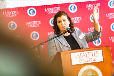 President Nicole Hurd speaks at a podium.