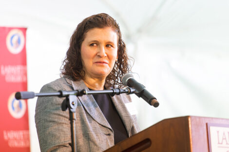 President Nicole Hurd speaks at a podium.
