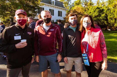 families mingle in masks outside