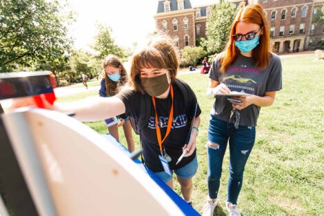 students in masks gather on Quad for Thrive event