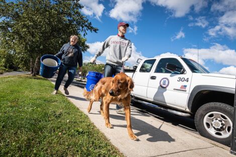 Stephen Wilson and golden retriever Rusty Buckets prepare to volunteer at Riverside Park.