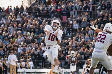 Aaron Angelos throws the football on the field