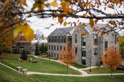 orange trees and green grass surround Oeschle Center for Global Education