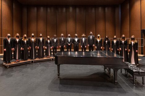 Chamber Singers pose as an ensemble on risers
