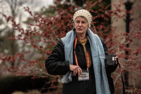 Katalin Fabian speaks into a microphone