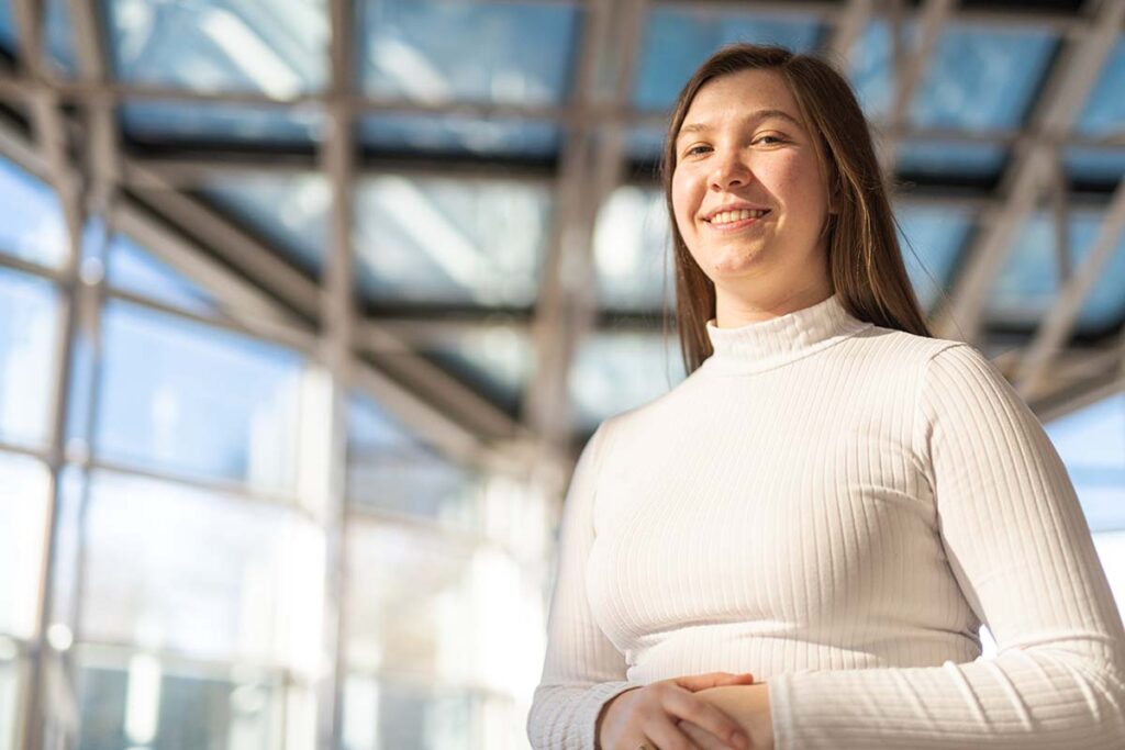 Anna Zittle stands in the Williams Center for the Arts lobby
