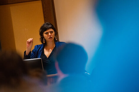 ValeriaLuiselli addresses faculty and staff seated from a podium in Kirby Hall of Civil Rights