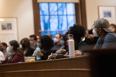 students in masks sit in classroom in Kirby Hall of Civil Rights