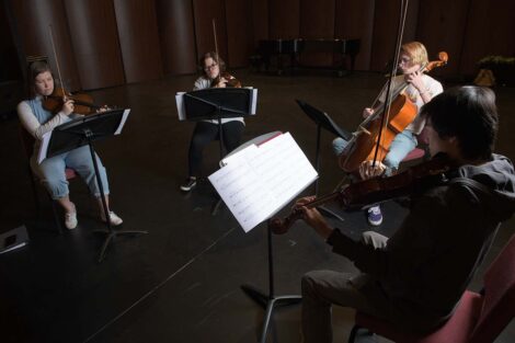 Quartet sits in half circle
