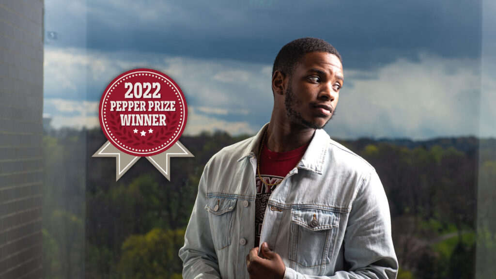 Alex Ashley '22 in front of a window in Rockwell Integrated Sciences Center