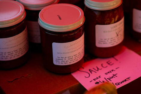 jars of sauce made with ingredients grown at LaFarm sit on a table
