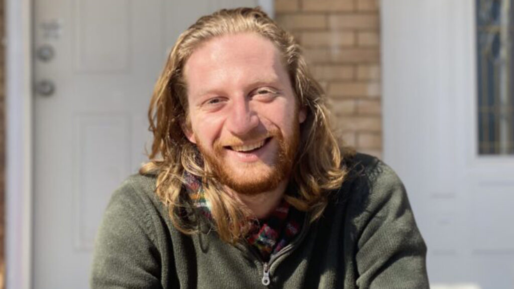 Matt Gustafson sits on his porch
