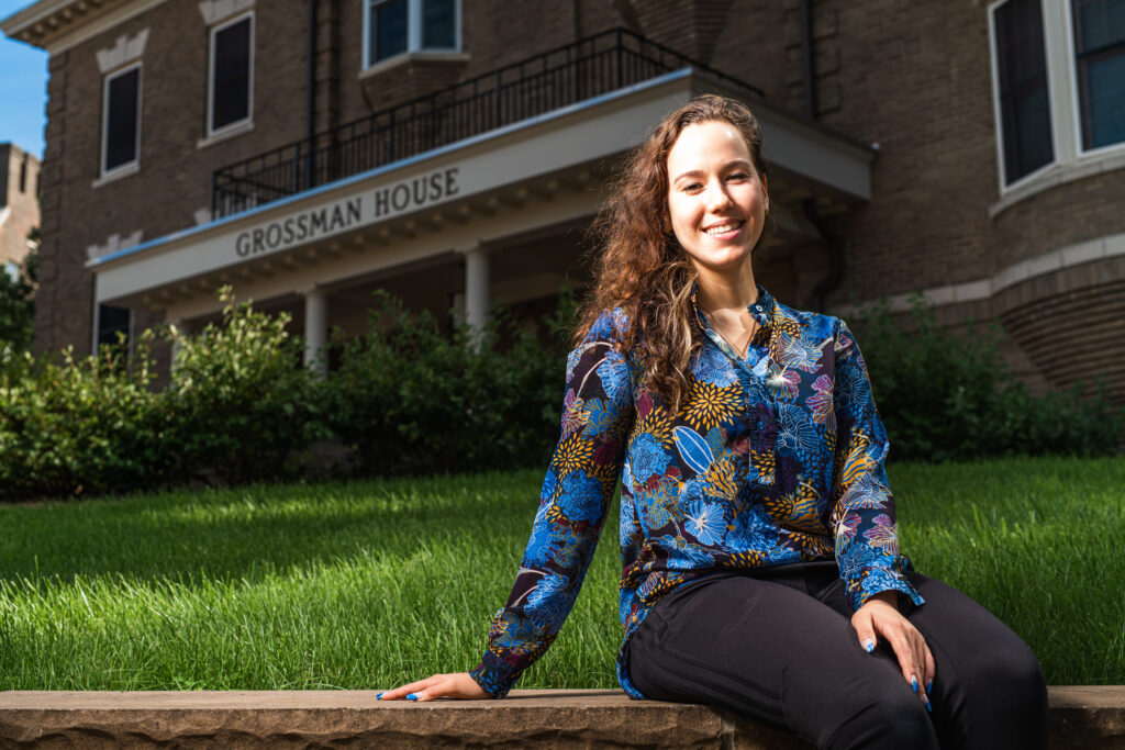 Milena Berestko sits outside Goodman House
