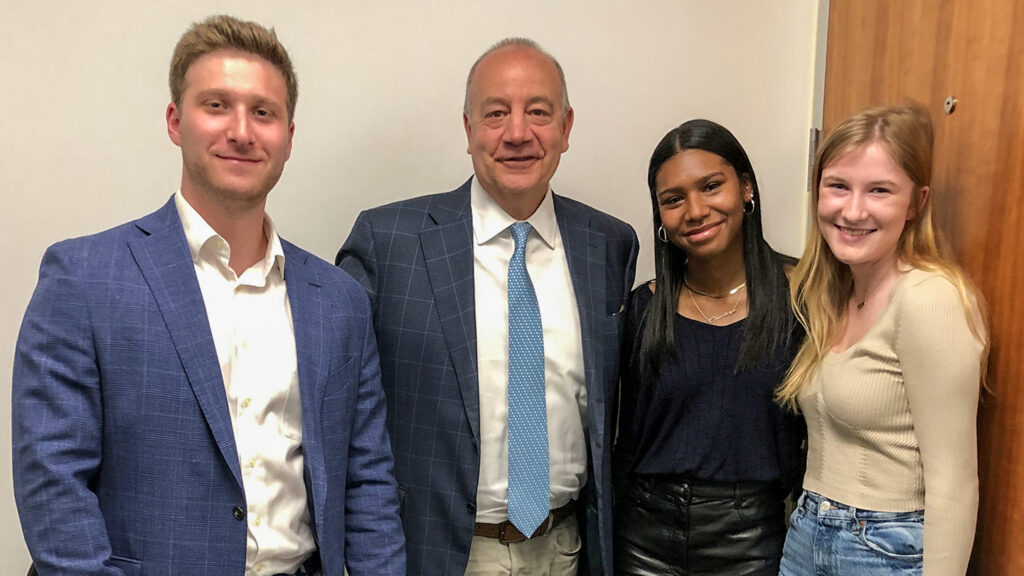  Bob Sell '84 with podcast team of Ty Sharinn '22, Charlize Cramer '24, and Maggie Fiesel '23