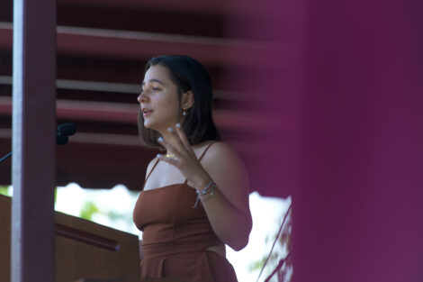 student stands at podium and talks